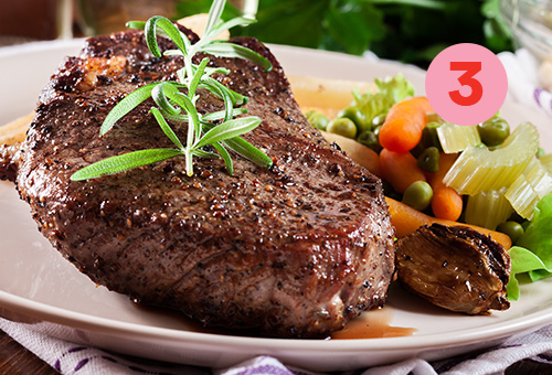 A rib eye steak with the perfect sides