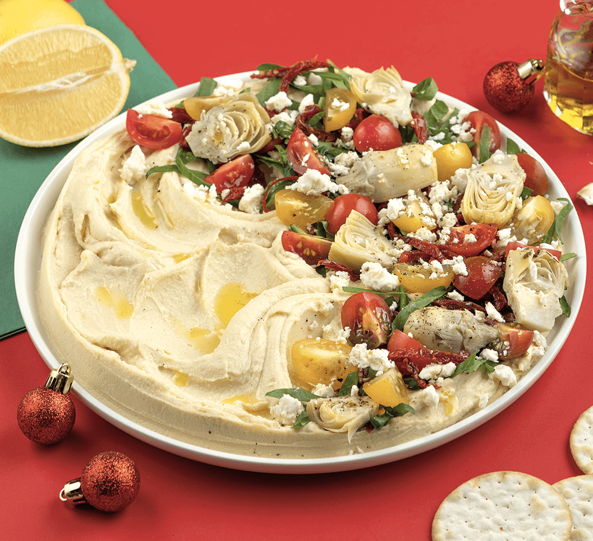trempette de hummus garnie de feta et légumes